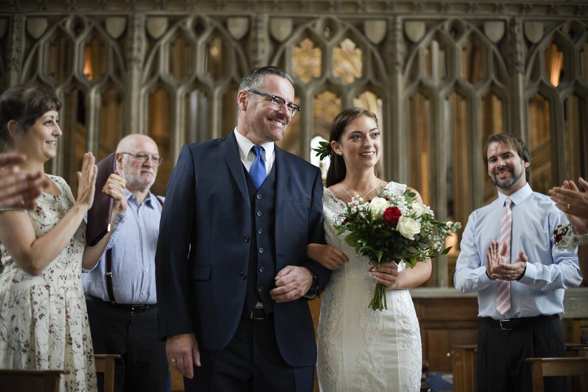 father-of-the-bride-walking-his-daughter-down-the-2022-12-16-00-32-37-utc