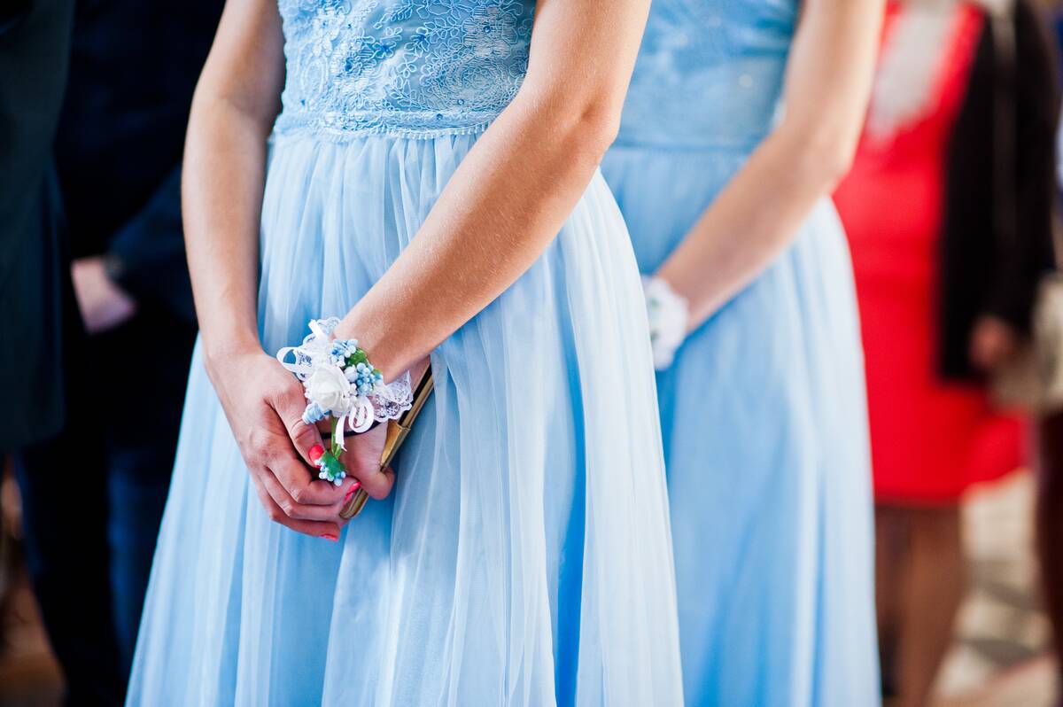 hands-of-bridesmaids-on-blue-dresses-at-wedding-2021-09-03-15-32-35-utc
