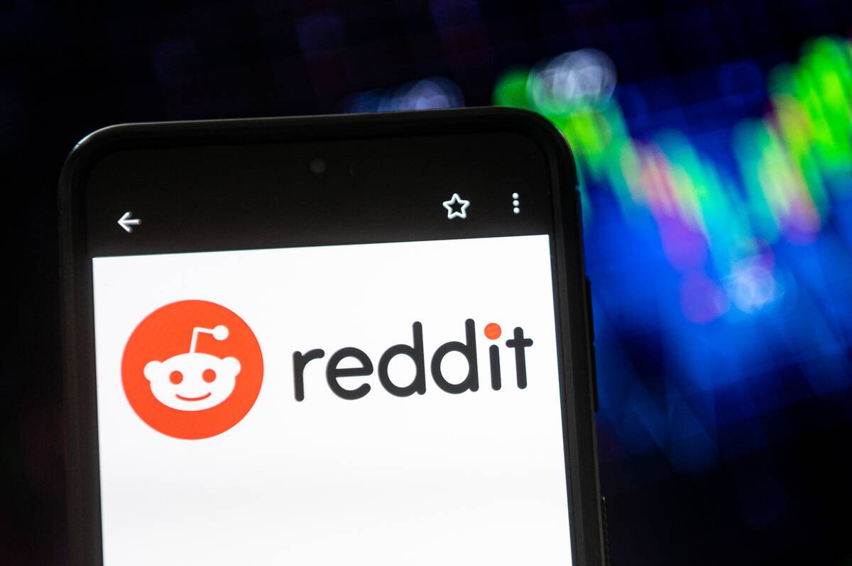 In this photo illustration a Reddit logo seen displayed on a...