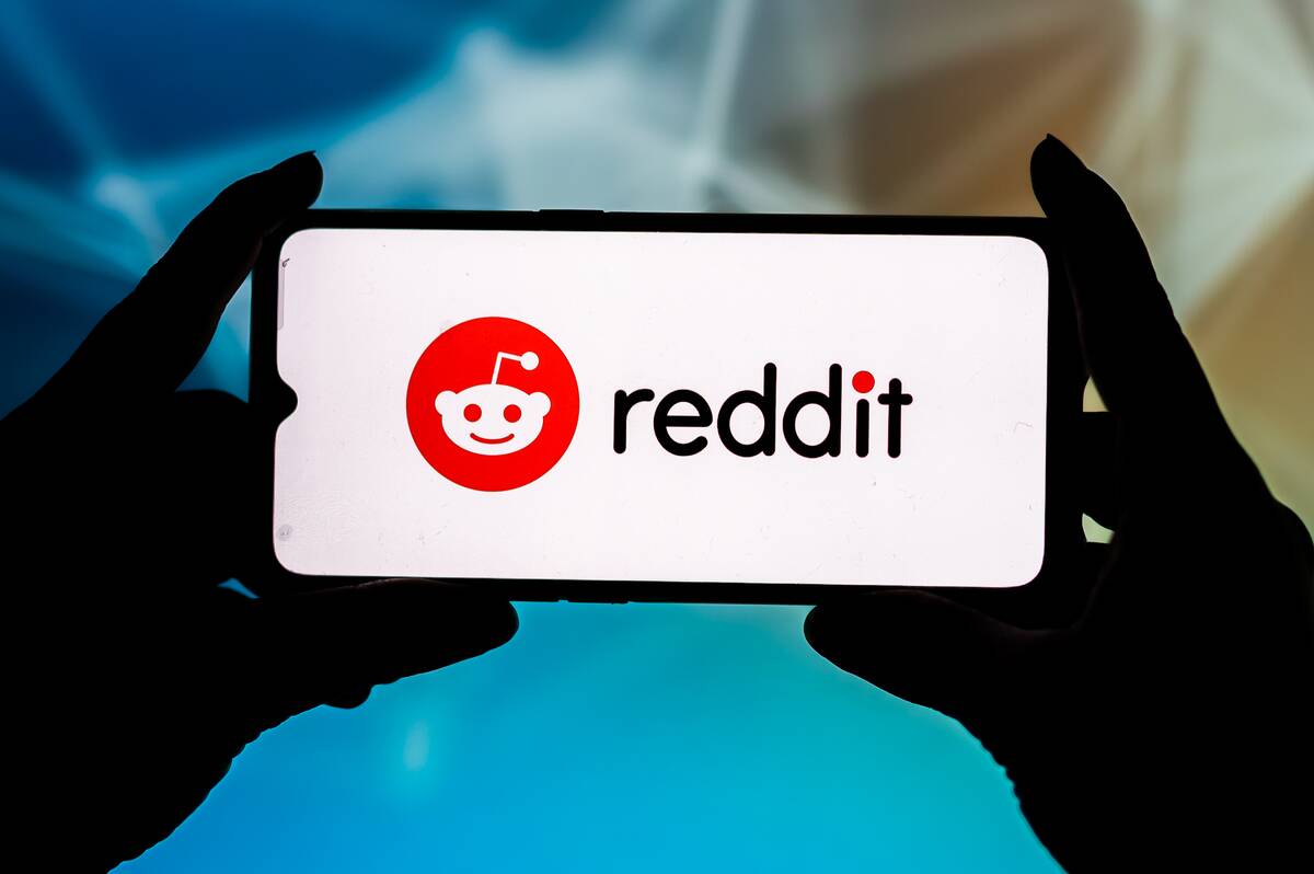 In this photo illustration a Reddit logo seen displayed on a...