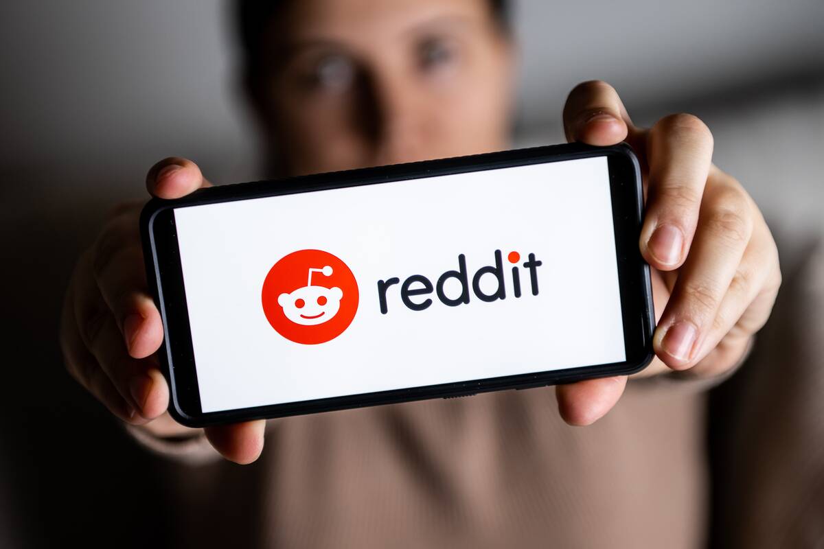 In this photo illustration, a Reddit logo seen displayed on...
