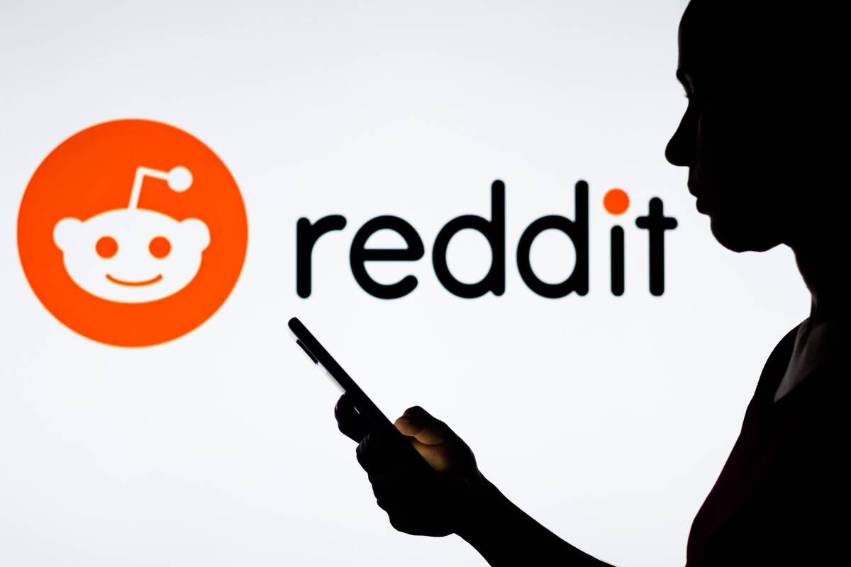 In this photo illustration, a woman's silhouette holds a...