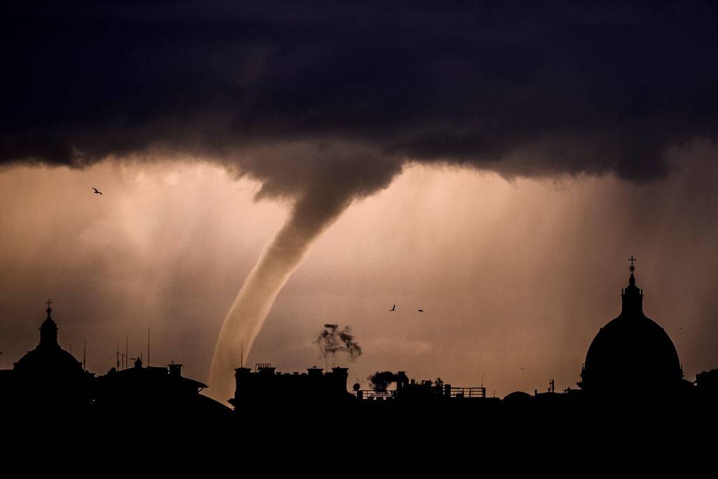 A tornado is seen in the sky over the city of Rome