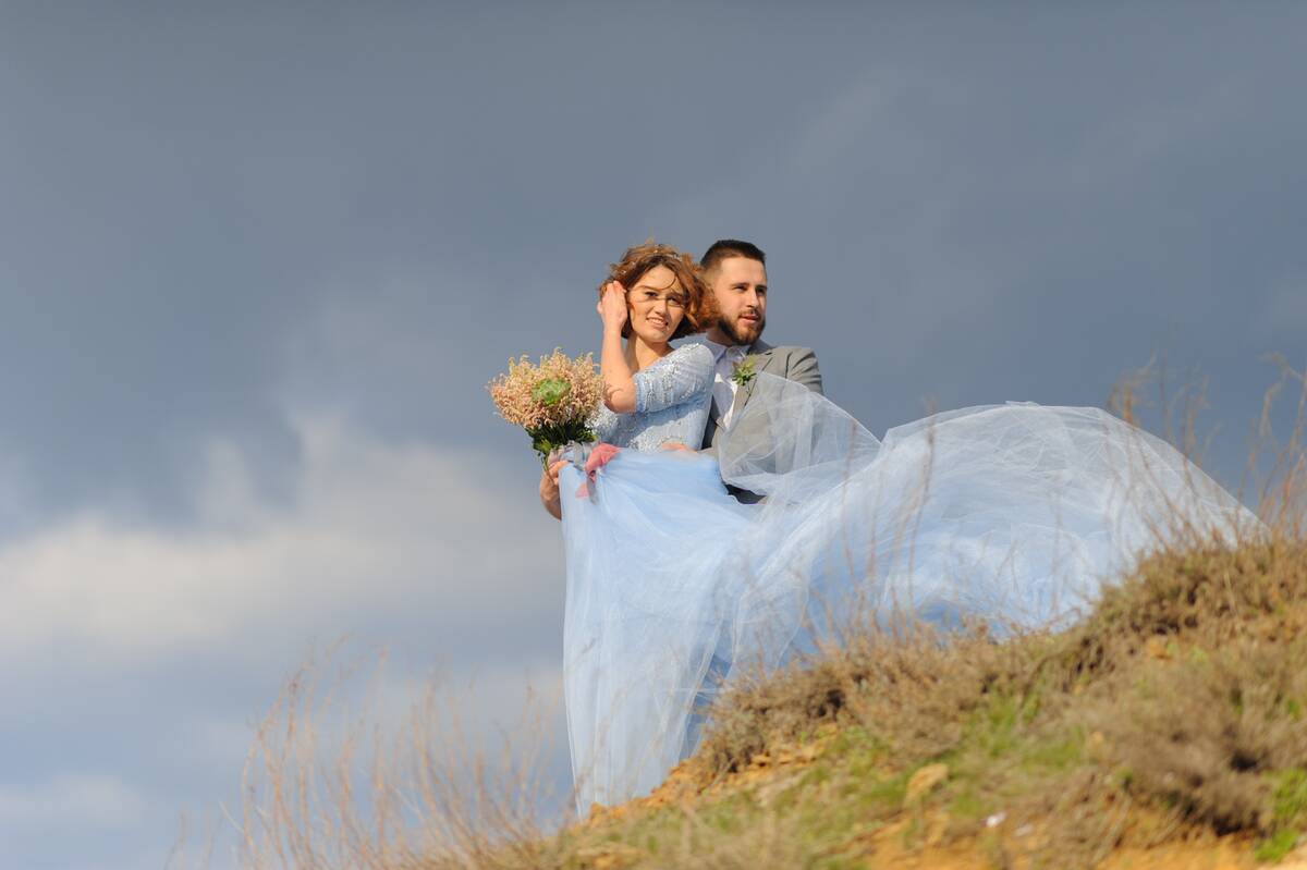 wedding-photo-session-of-a-couple-on-the-seashore-2021-09-01-01-22-26-utc