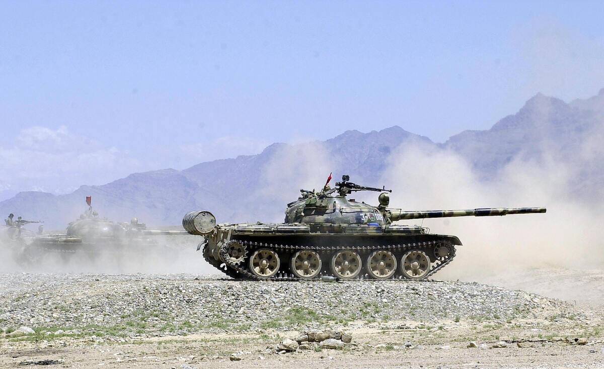 Afghan National Army soldiers fire tanks