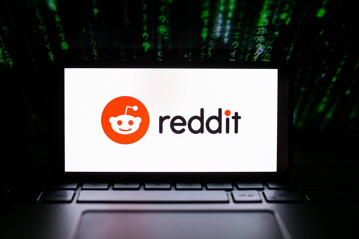 In this photo illustration a Reddit logo seen displayed on a...