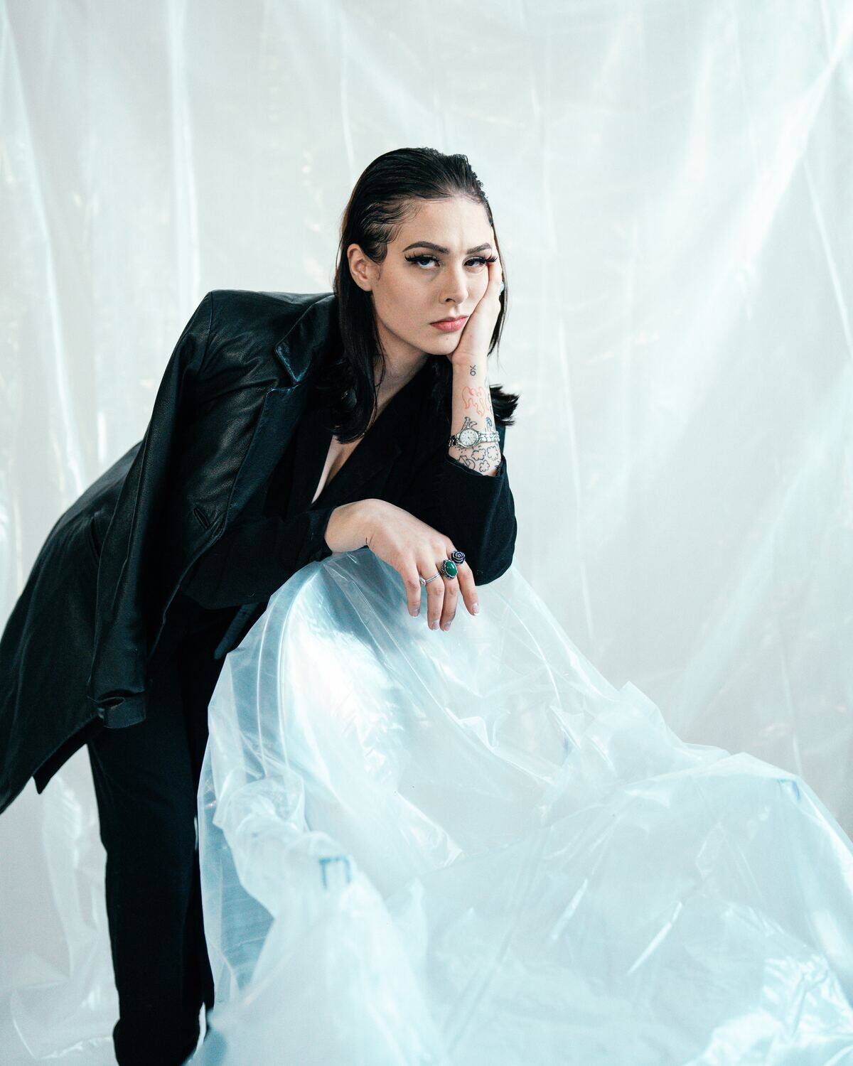 woman in leather jacket looking disappointed