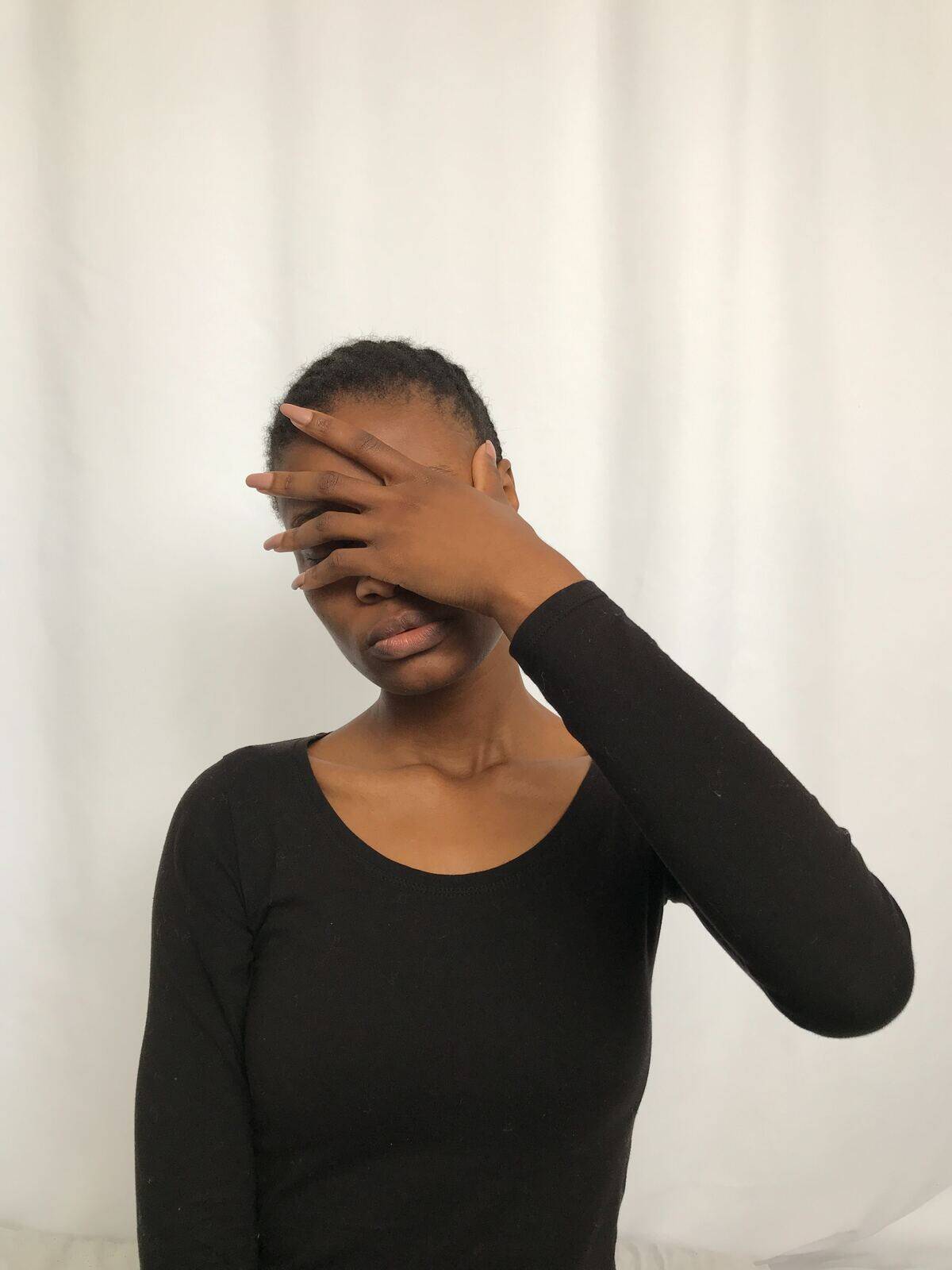 woman putting hand over her face in exasperation