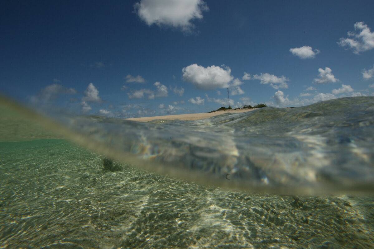 Aerial view of Masig Island in the Torres Strait. King tides and strong winds ha
