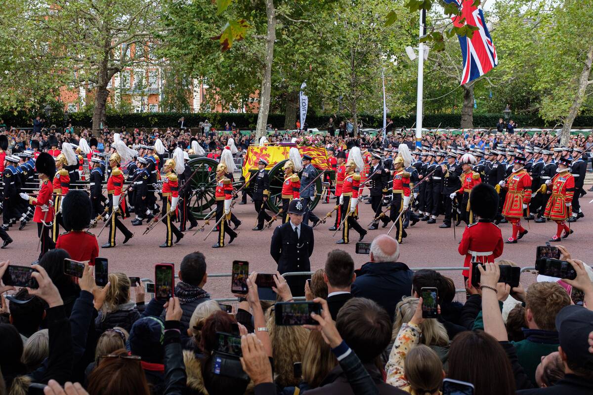 Grenadier Guards accompany the Queen's gun carriage as they...