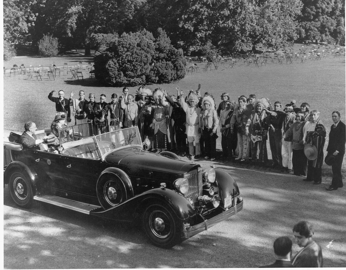 Members of Najavo and Pueblo Tribes Waving to President and Mrs. Roosevelt, on the grounds of the White House.