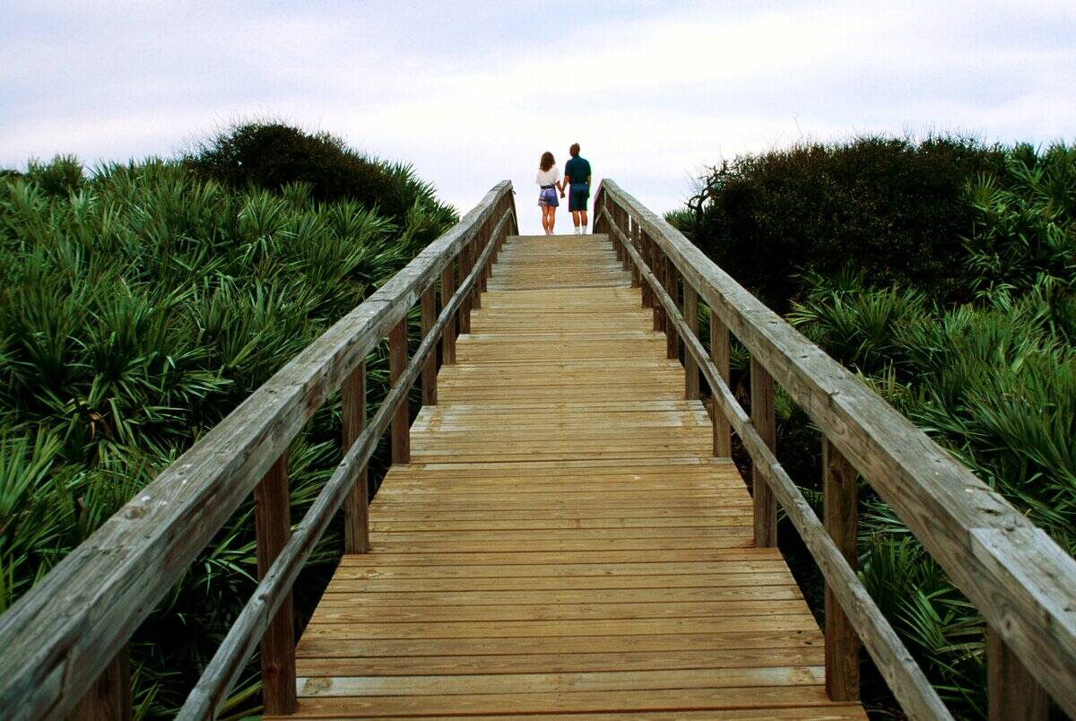 Couple On Boardwalk To Playalinda Beach
