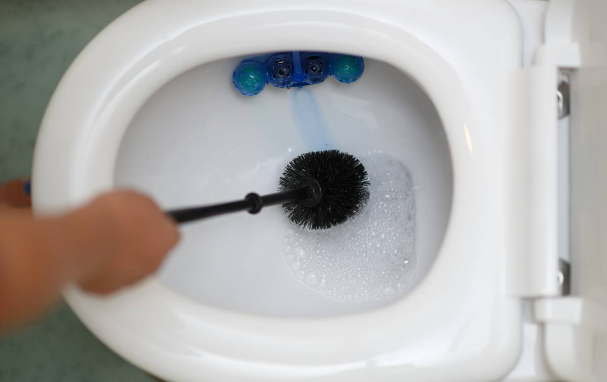 With smartphone on the toilet