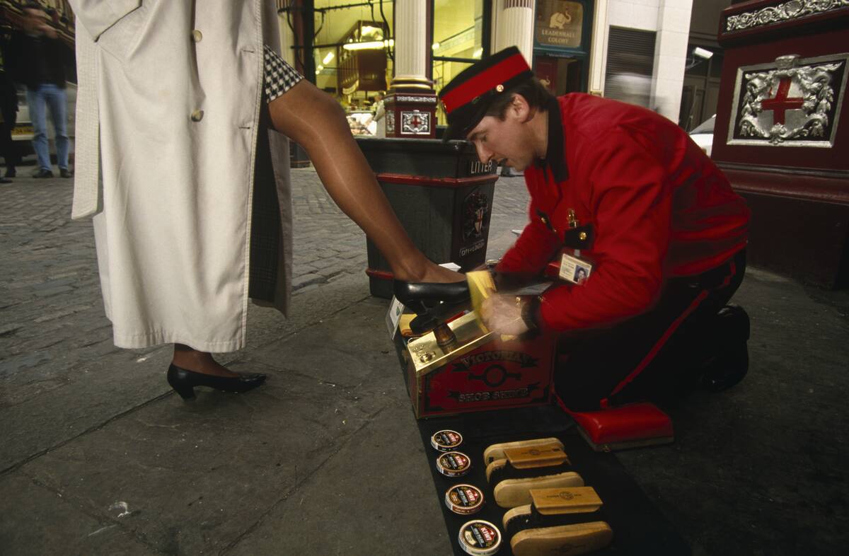 England - London - Shoe-shiner service for a businesswoman