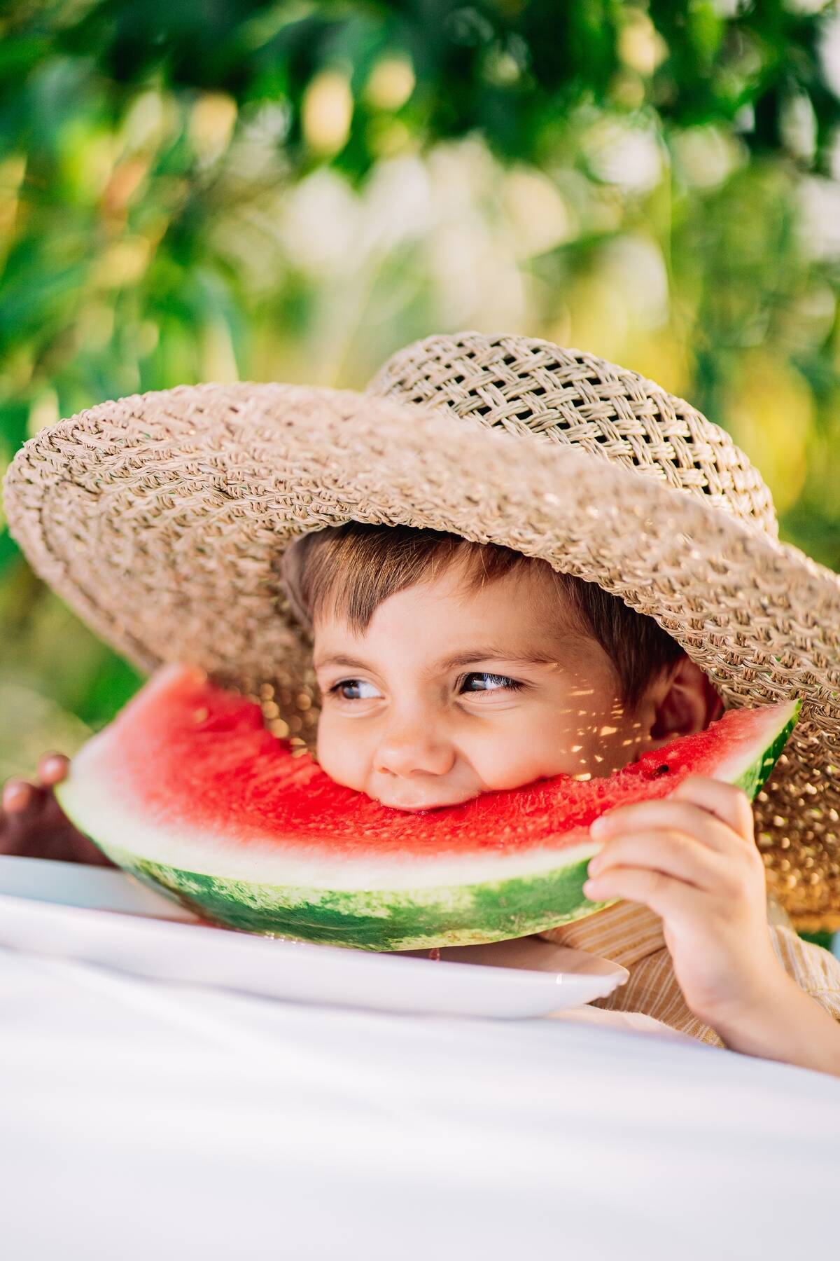 handsome-toddler-boy-eating-fresh-red-watermelon-2025-03-09-09-41-46-utc