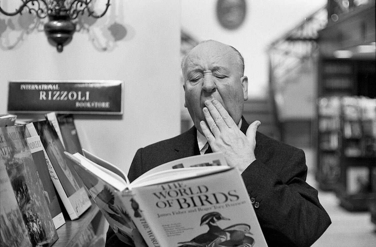 Alfred Hitchcock Yawning over Book of Birds