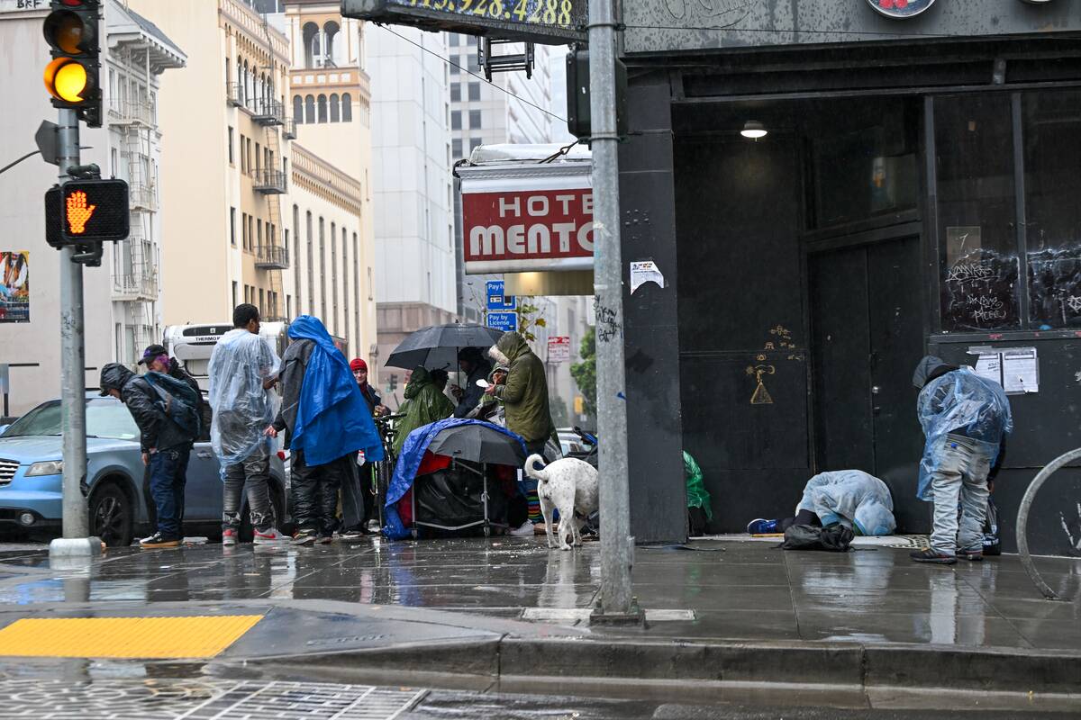 Homeless people struggle during heavy rain in San Francisco, California