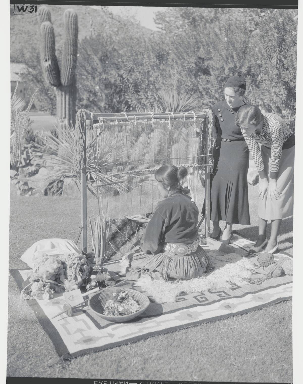 Indian Demonstrating Making of Navajo Rug