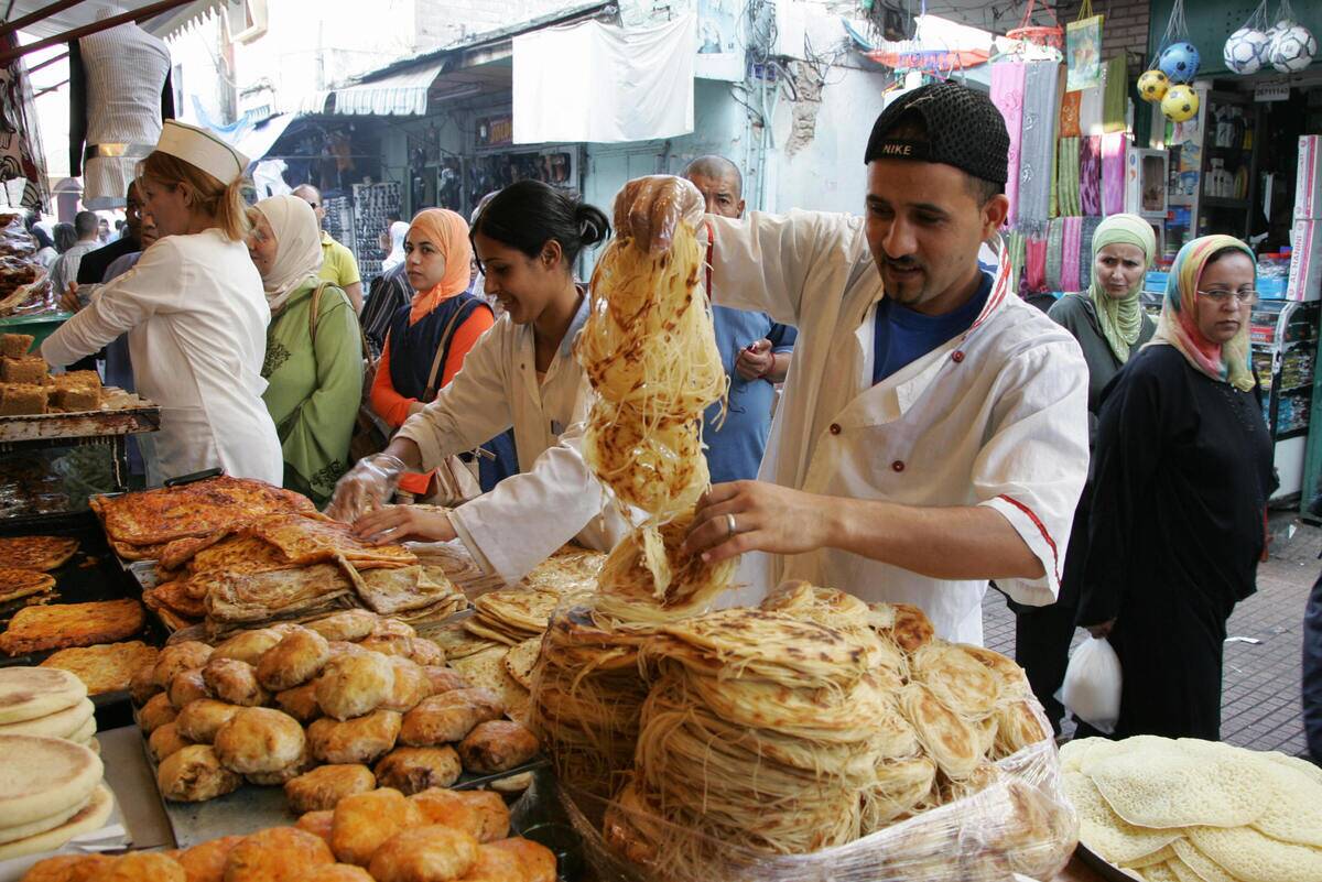 A baker sells various breads in the medi