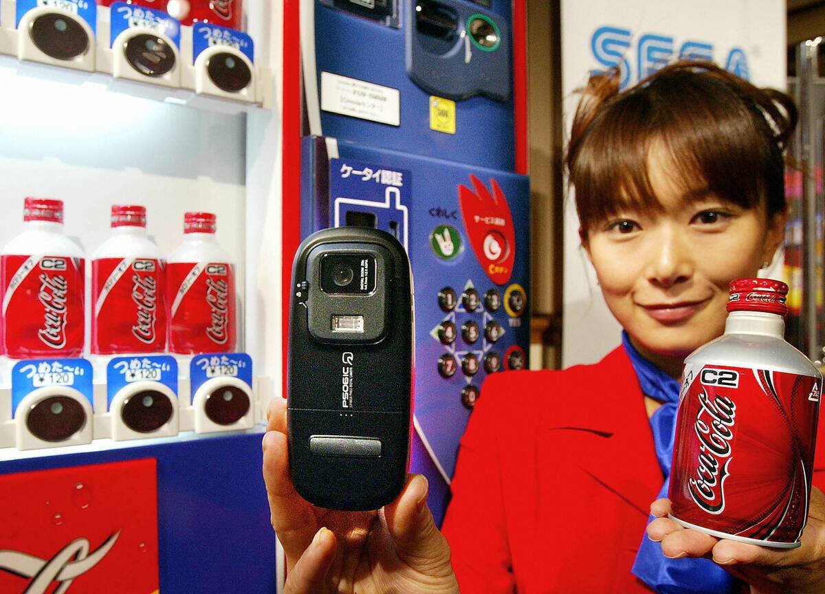 An employee for Coca-Cola Japan demonstr