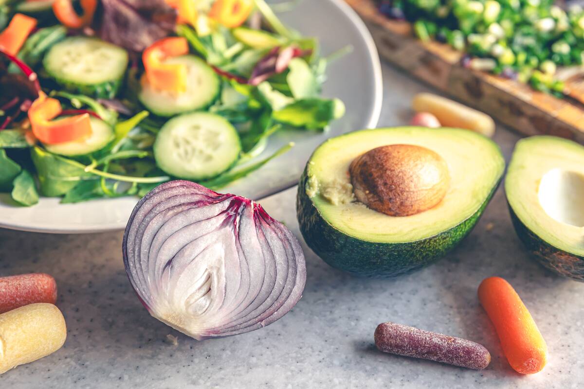 avocado-halves-on-the-kitchen-table-with-chopped-f-2025-03-13-16-47-48-utc
