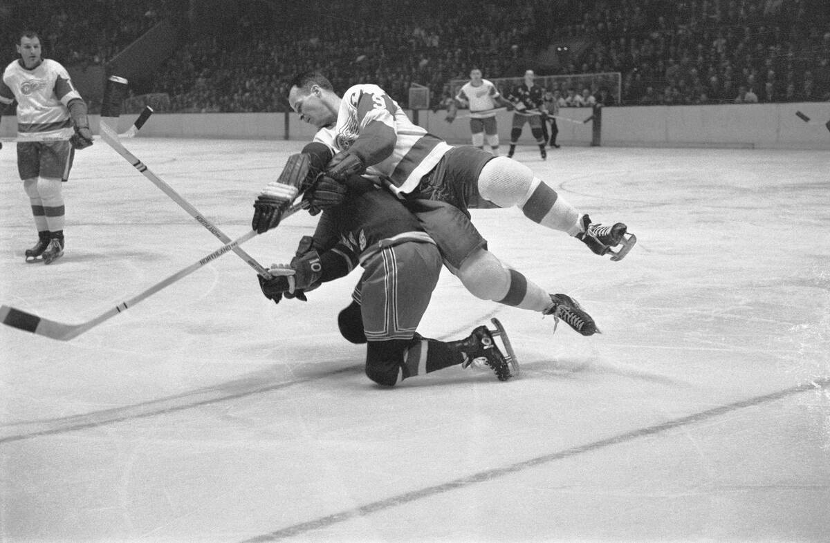 Gordon Howe Tumbles Over Opponent in Game