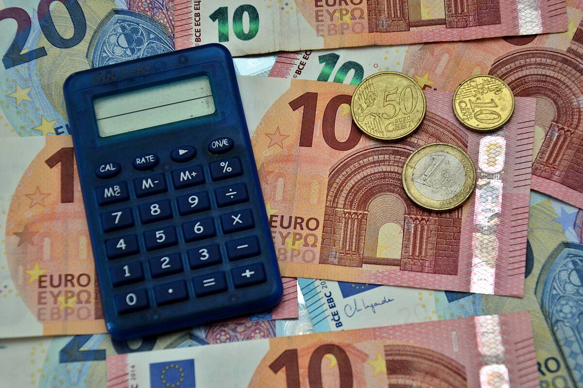 In this photo illustration, a calculator seen on euro...