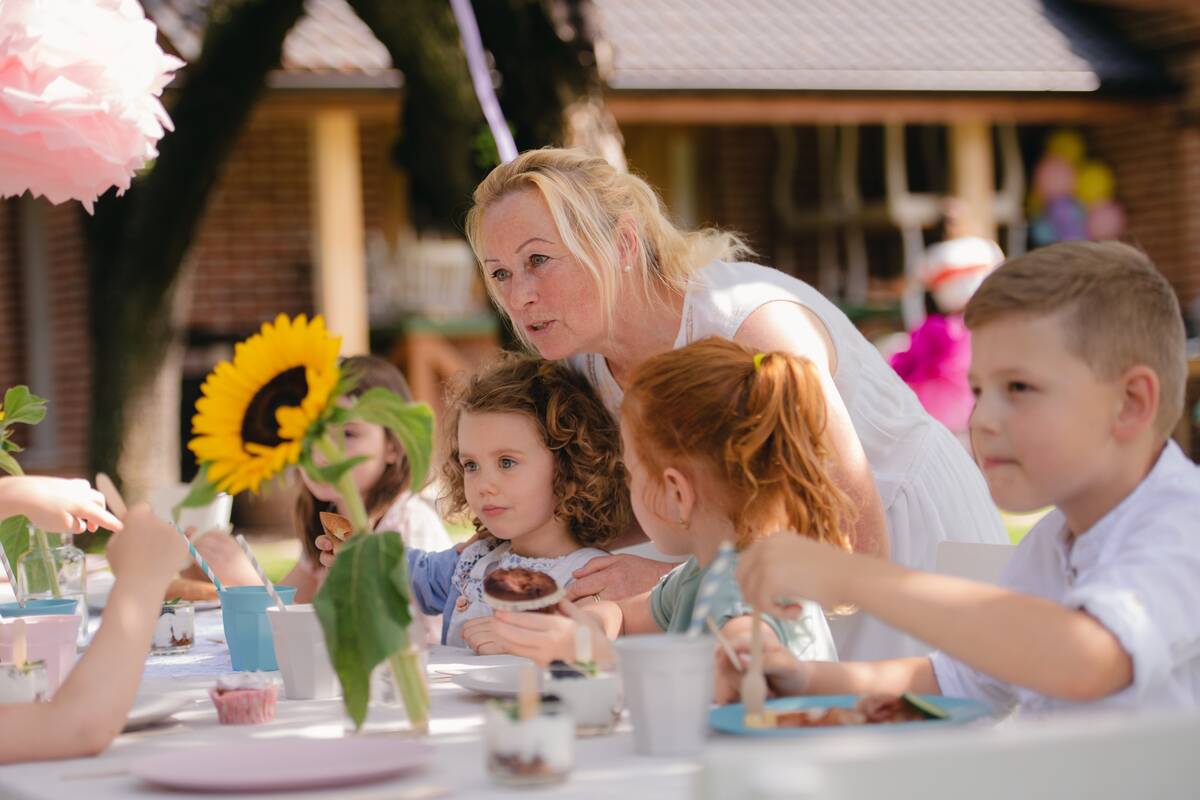 small-children-sitting-at-the-table-outdoors-on-ga-2024-10-18-08-28-59-utc