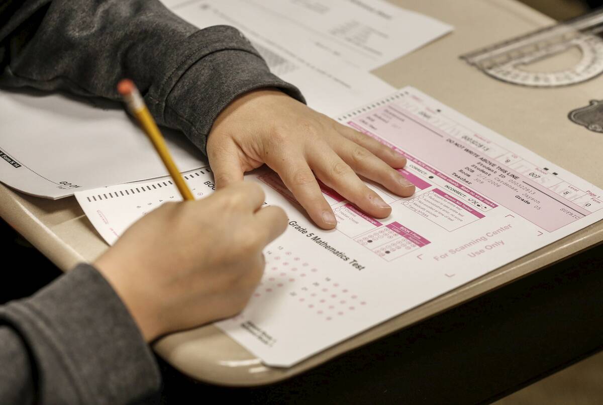 Student takes math test on Long Island
