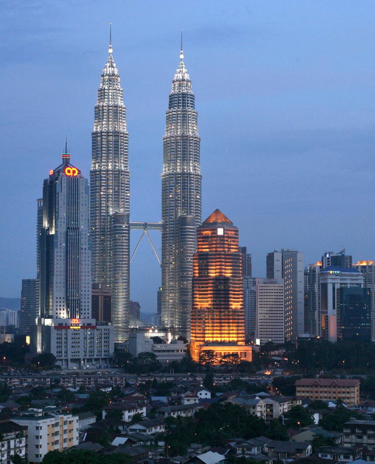 The headquarters of AmBank Bhd., left, and Public Bank Bhd,