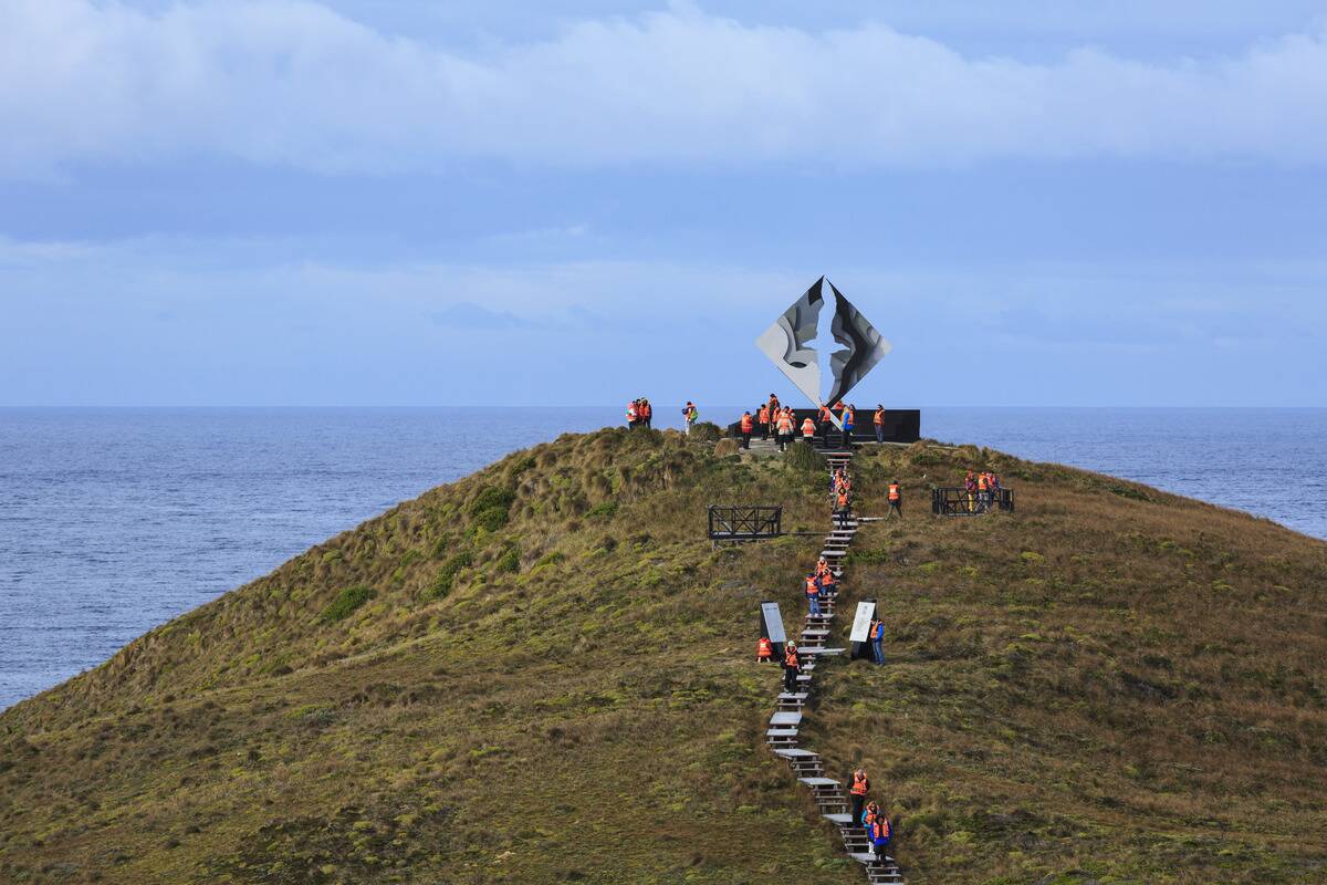 Tourists At Cape Horn Visiting Drake Passage Memorial In Tierra Del Fuego, Chilean Patagonia; Magallanes, Chile