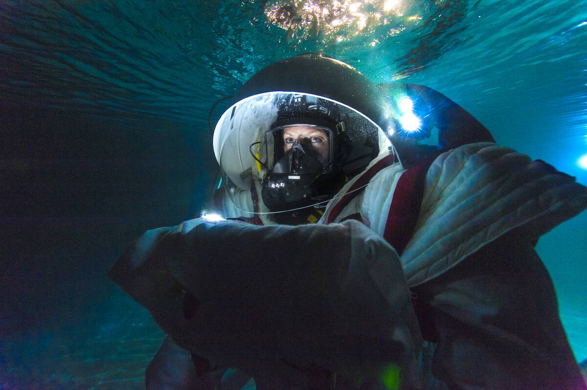 Underwater training session in spacesuit