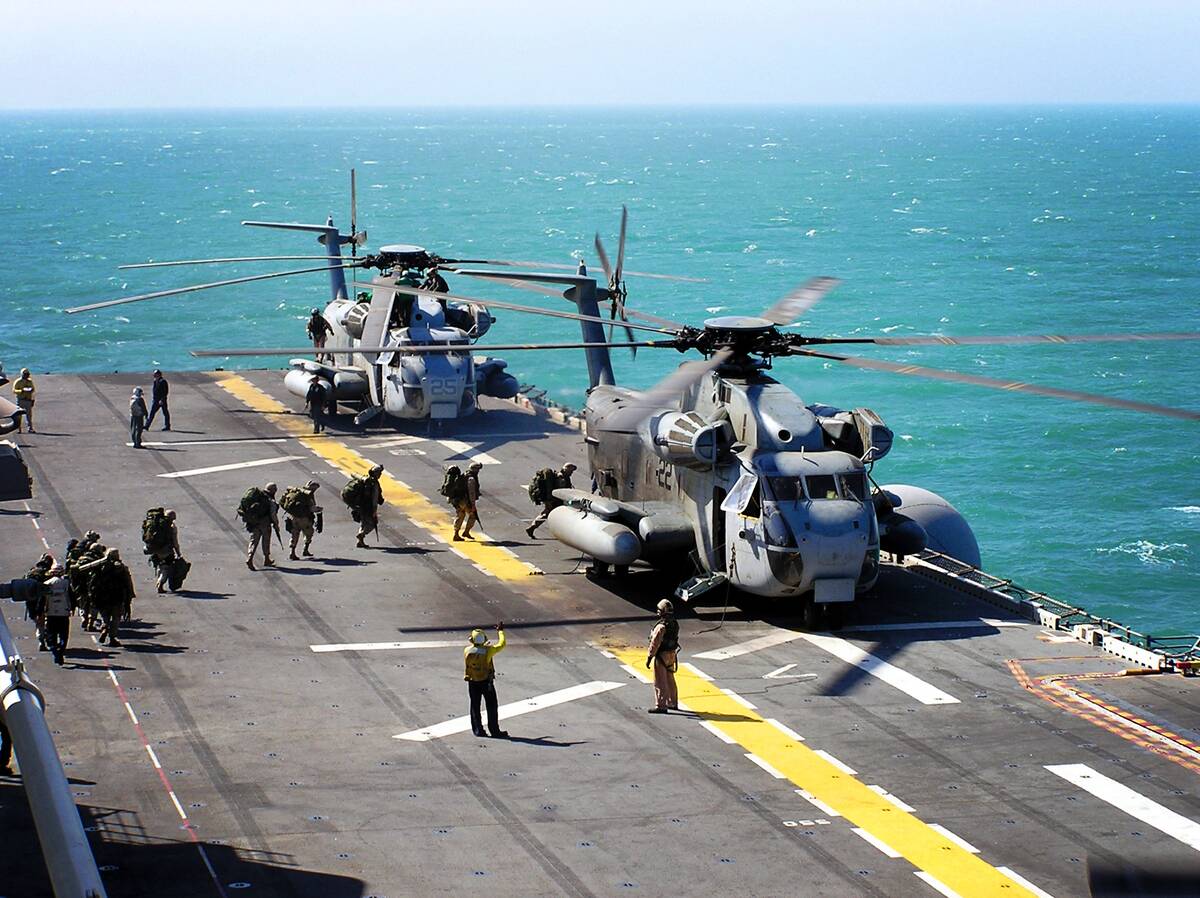 USMC Troops embark CH-53E for OIF