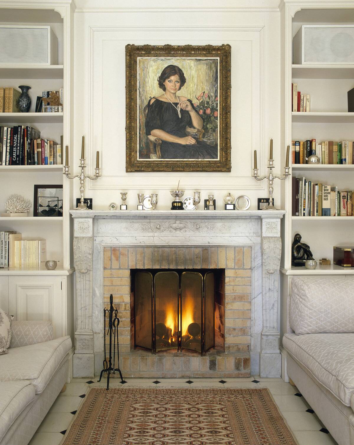 View of a lit fireplace in a living room