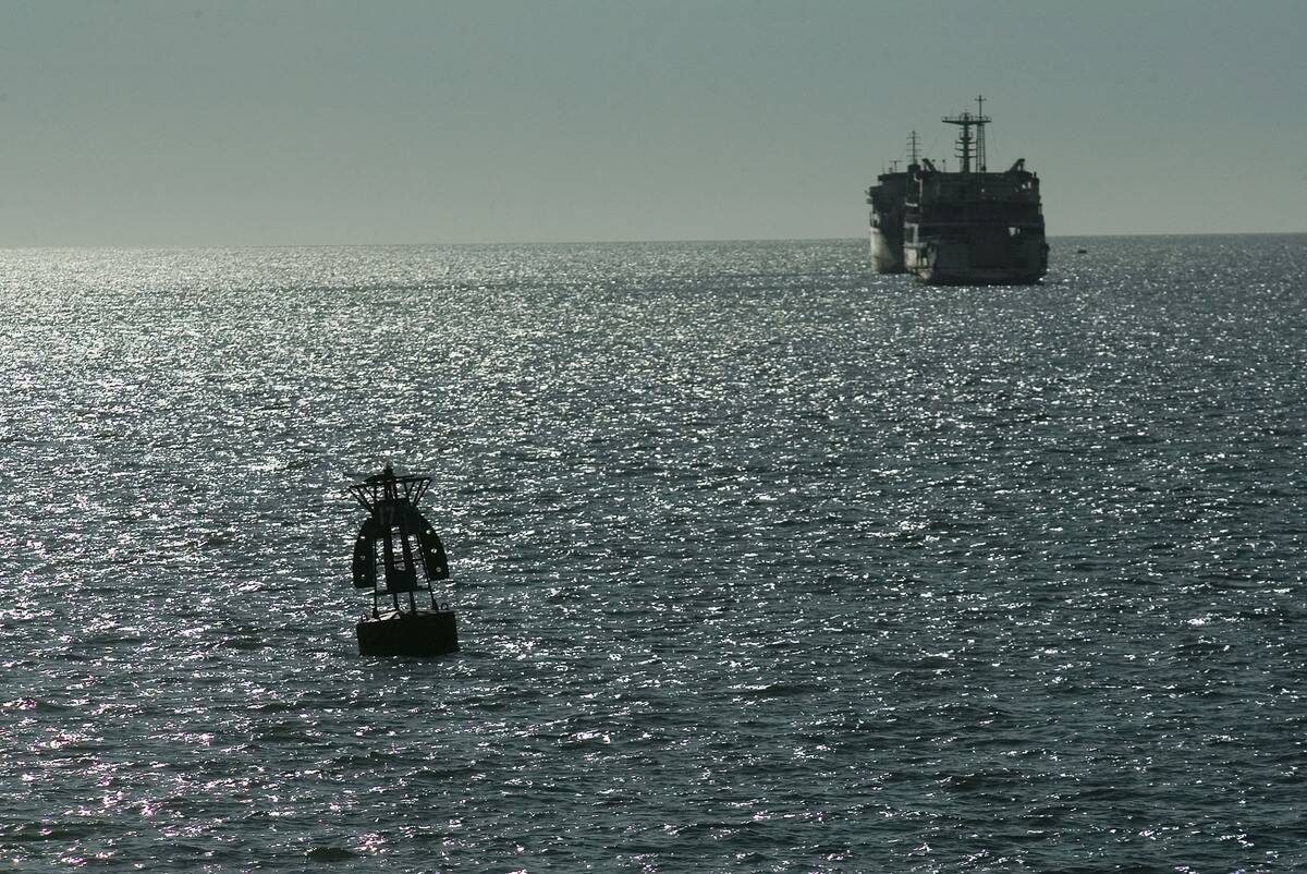 Workers Maintain Buoys At Haikou