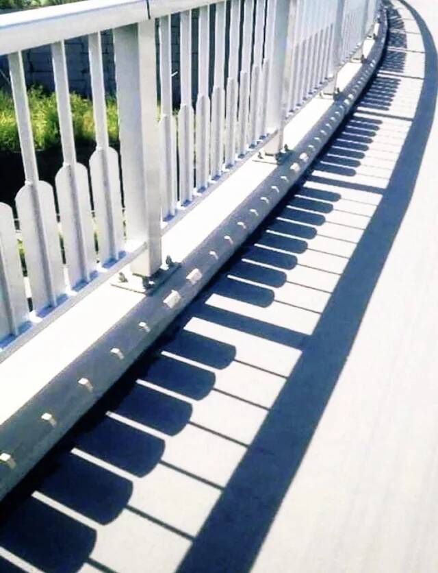 a-fence-with-shadows-that-look-like-piano-keys-v0-0urds3k2snpe1