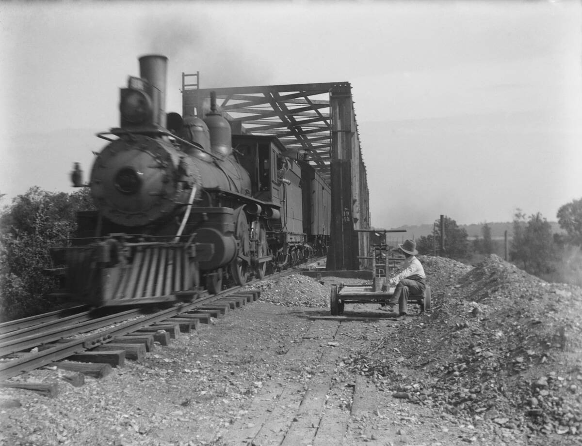 Steam Locomotive On Iron Bridge
