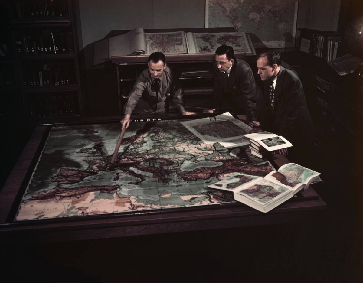 U.S. Air Force Personnel Looking at German Map