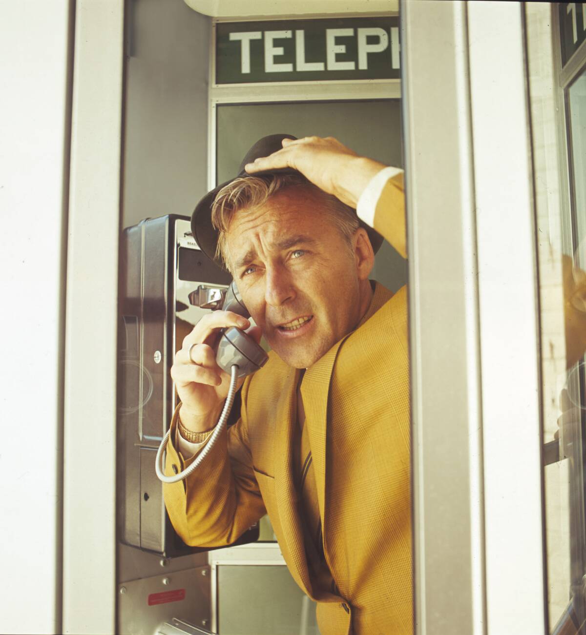 Anxious Man In Phone Booth