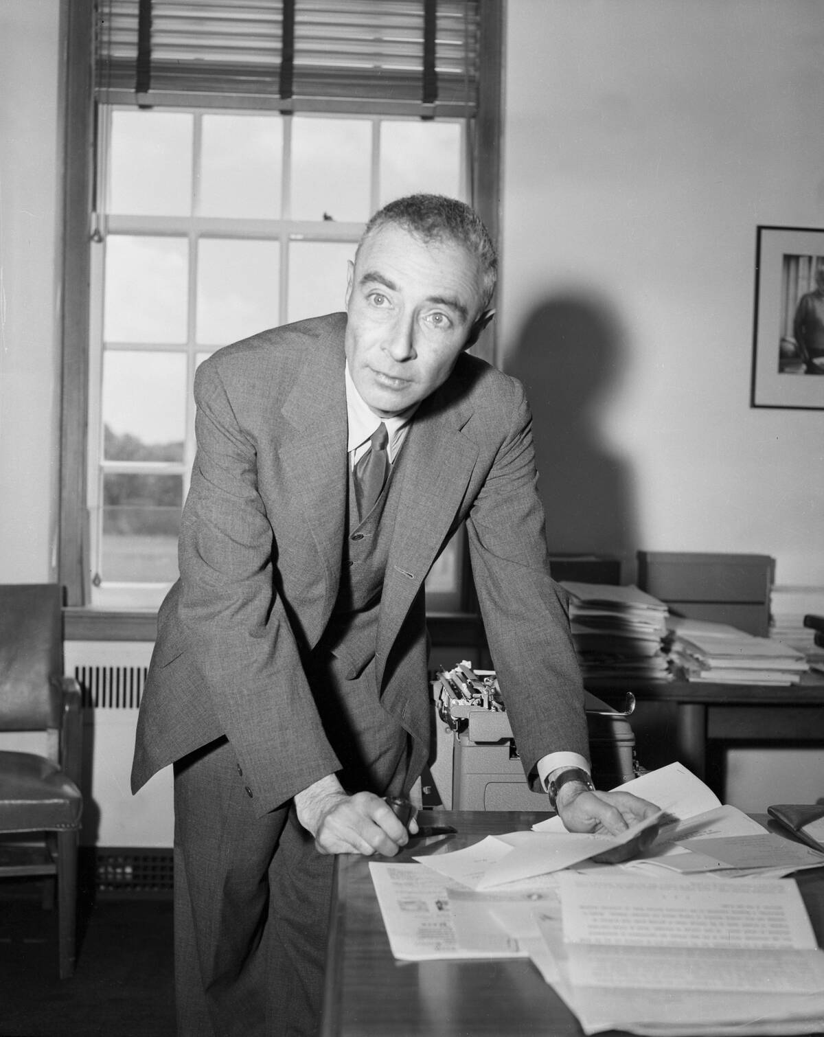 Dr. Robert Oppenheimer Leaning on Desk