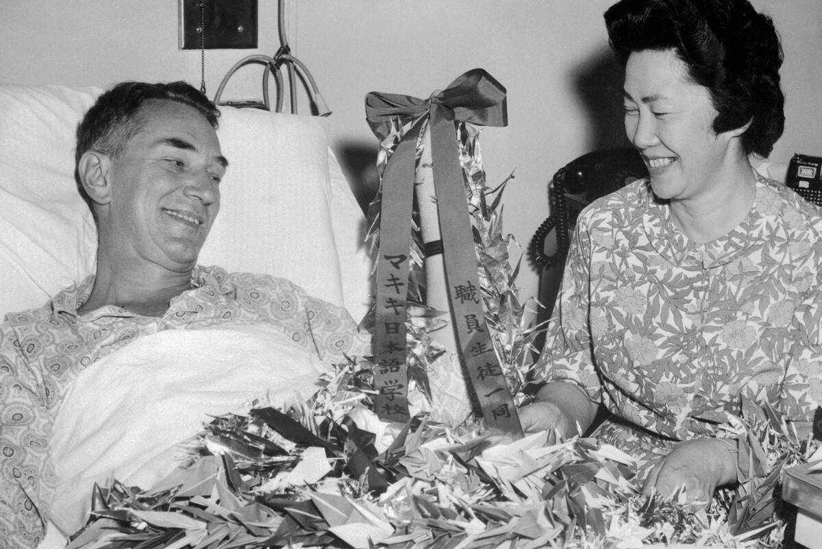 Edwin Reischauer and Wife Haru Admiring Gift