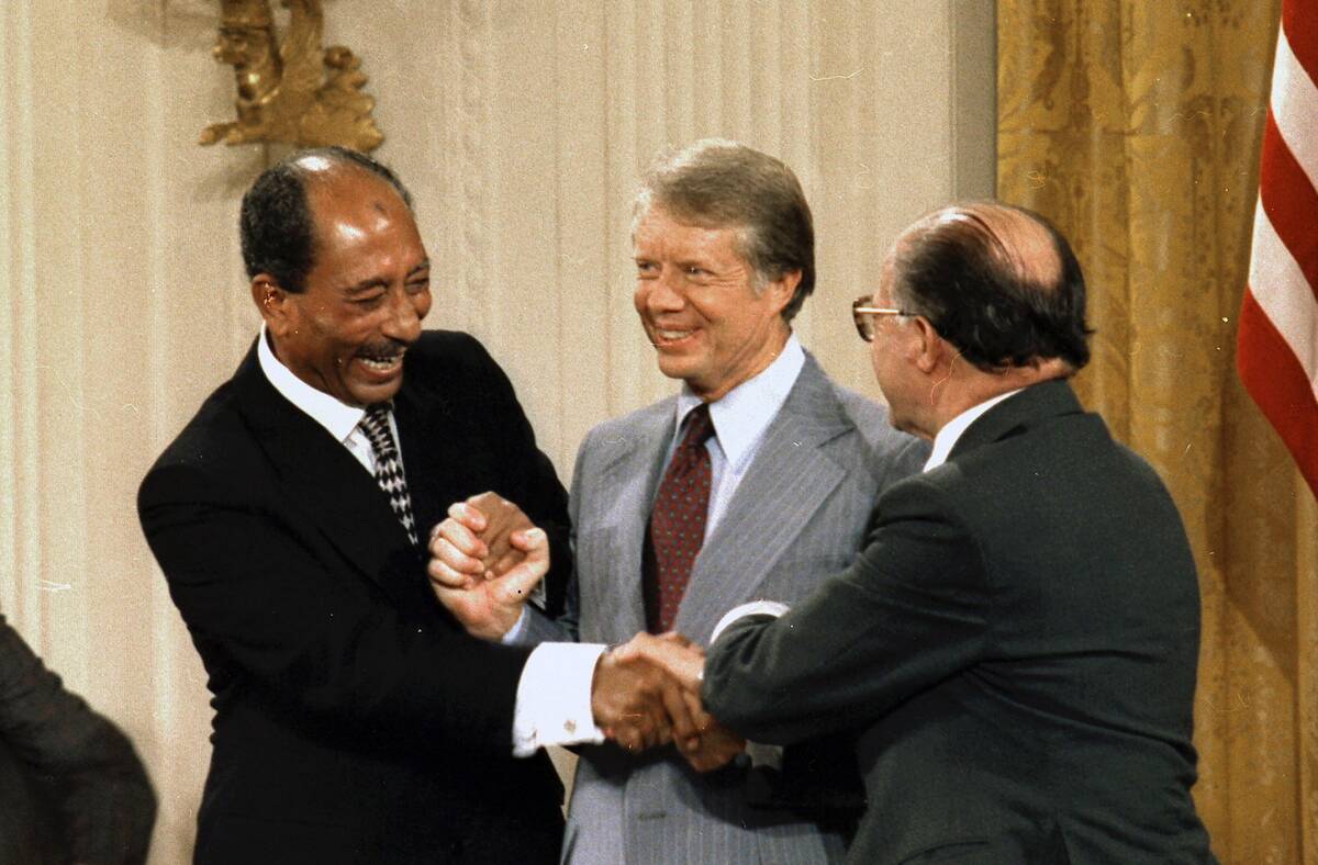 Egyptian President Anwar Sadat, United states President Jimmy Carter and Israeli Prime Minister Meacham Begin, celebrate.