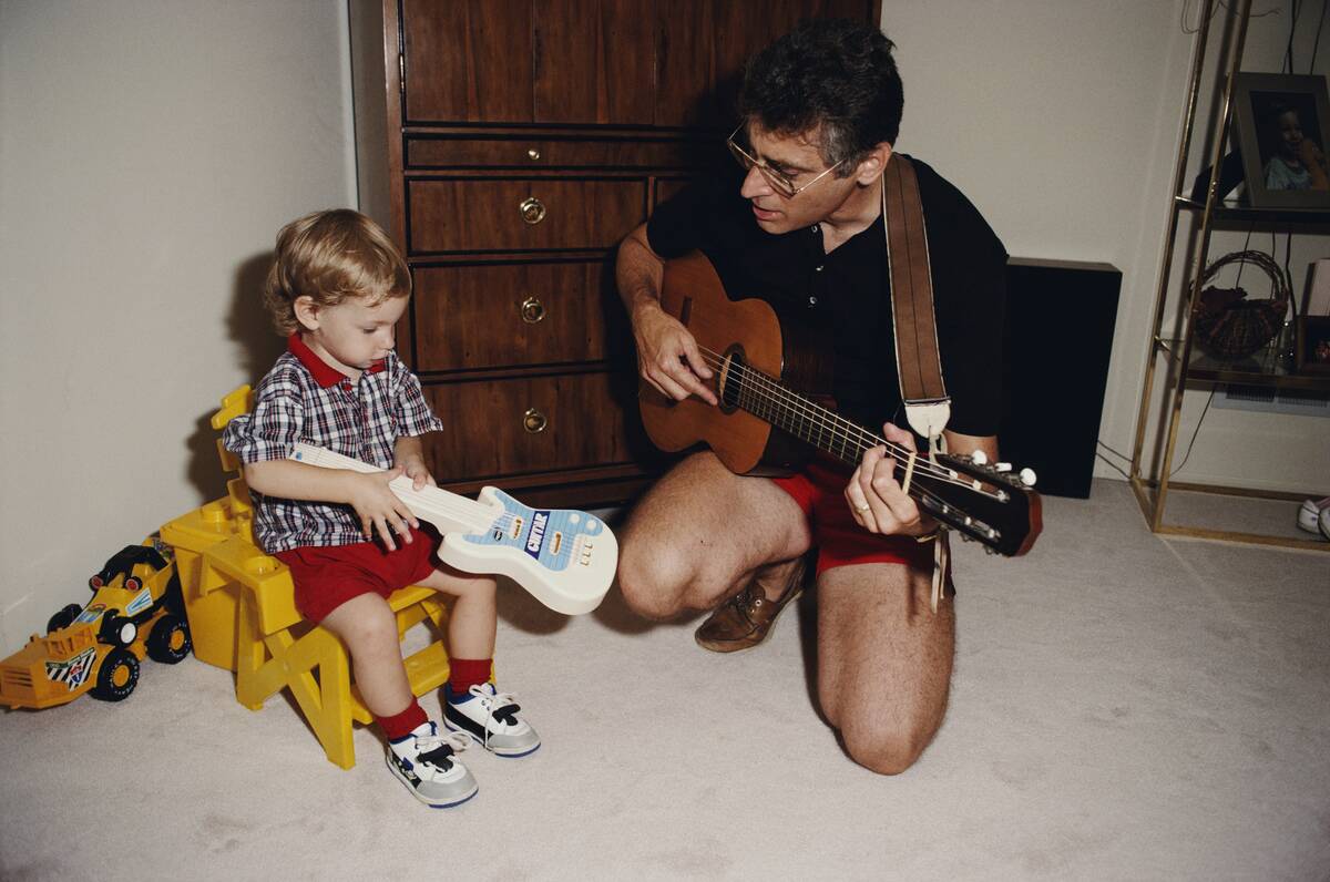 Father And Son With Guitars