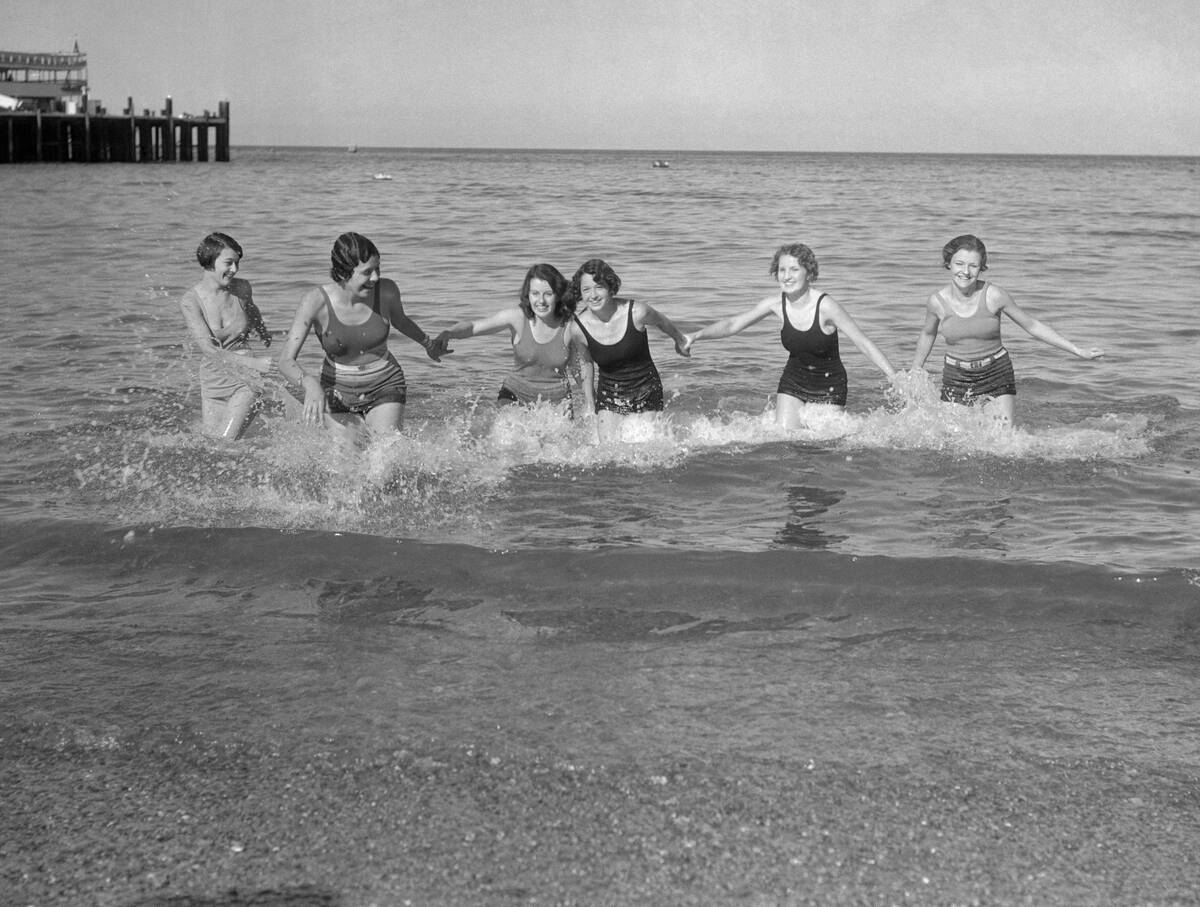 Group of young woman in sea holding hand, Santa Catalina Island, California, USA. March 03, 1932