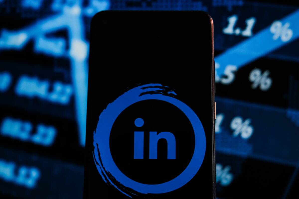 In this photo illustration a LinkedIn logo displayed on a...