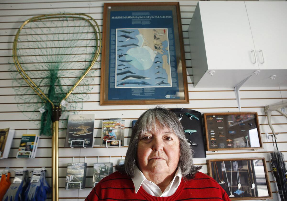 Peggy Beckett, owner of Huck Finn Sportfishing, poses in her