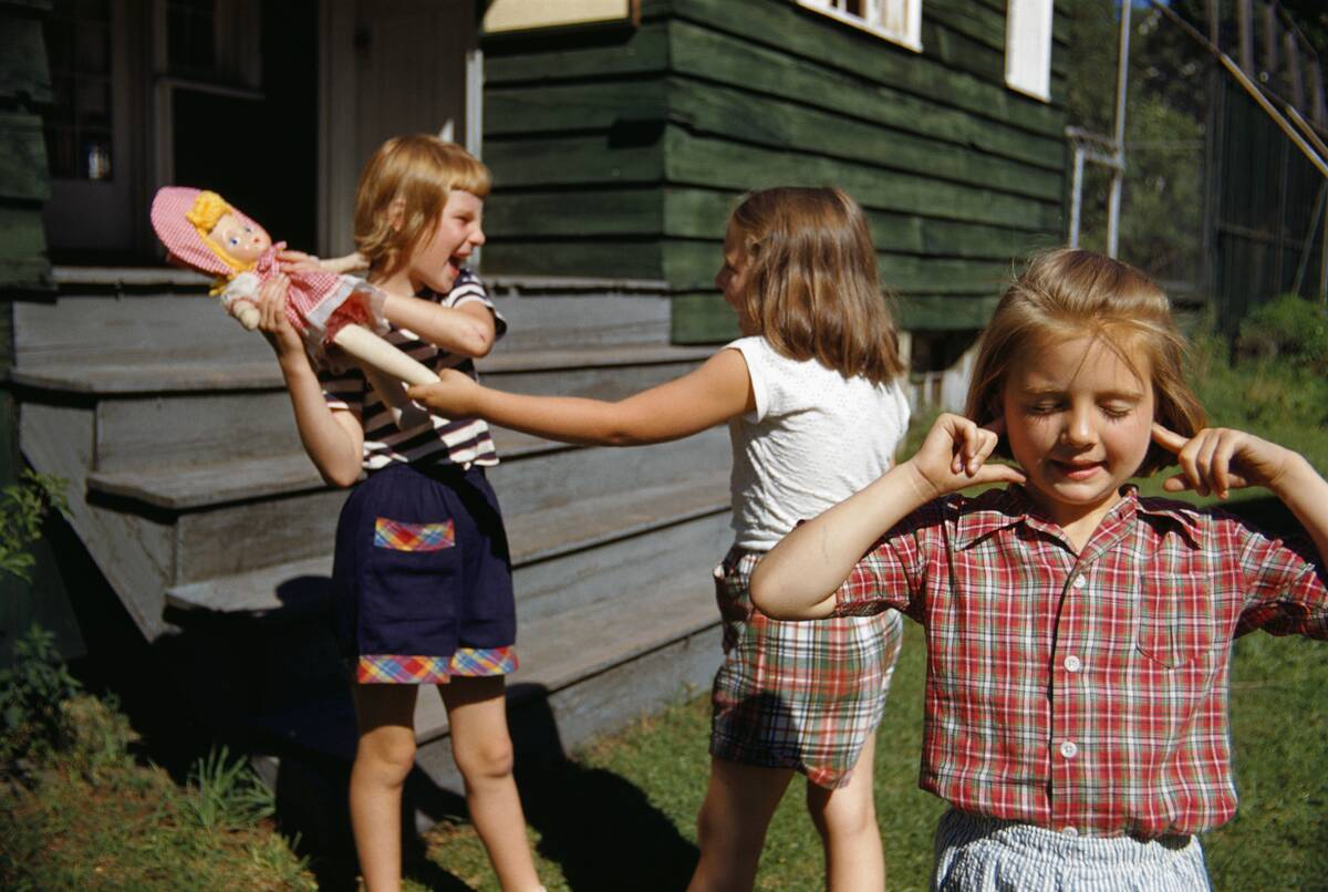 Plugging Ears as Girls Fight over Doll