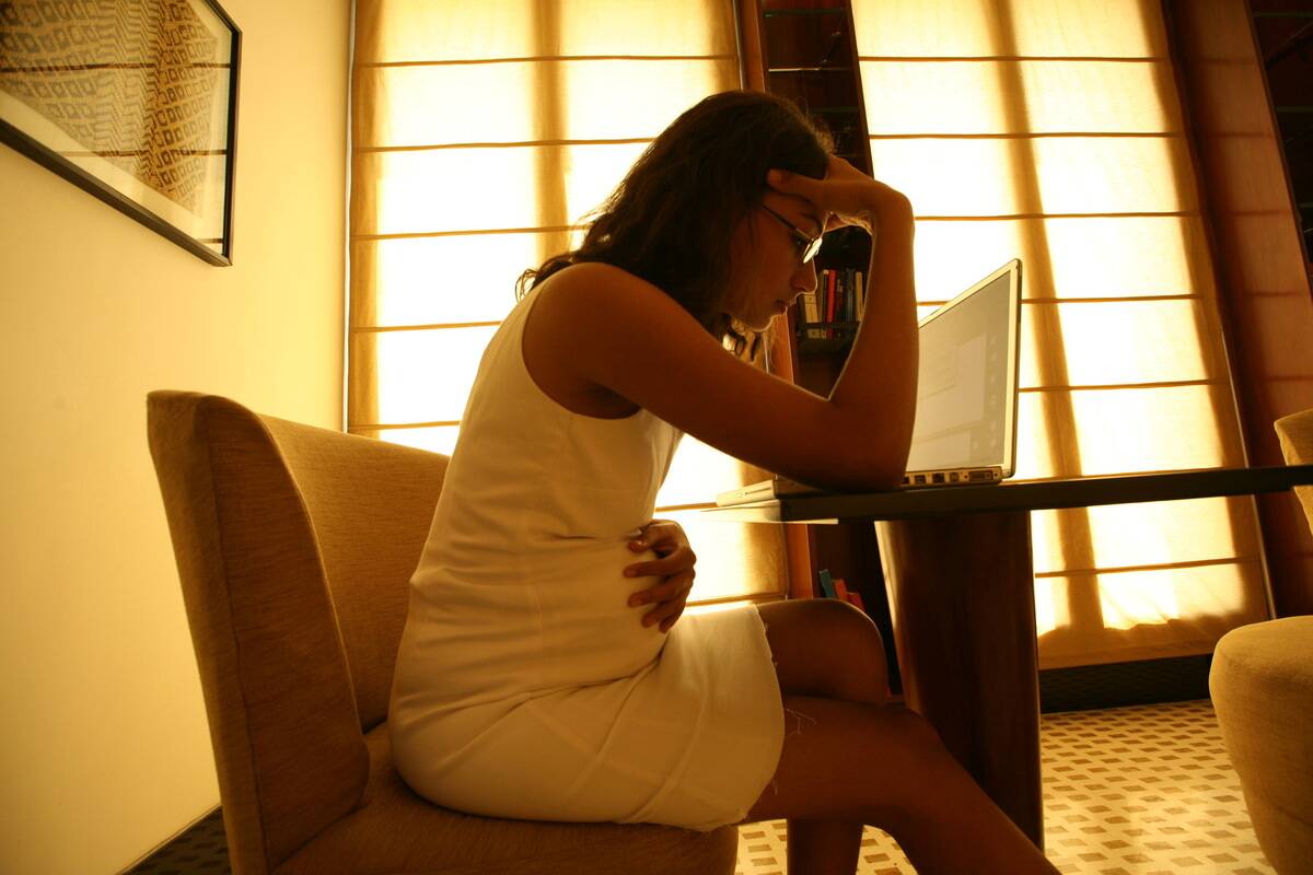 Pregnant woman facing work stress, headache at her Residence in New Delhi, India ( Model, Sex )