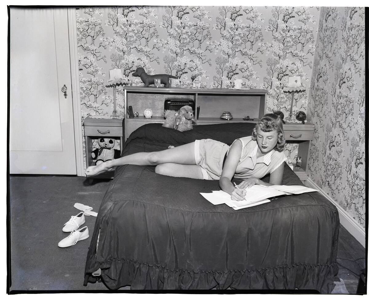 Teenager Studying In Her Bedroom
