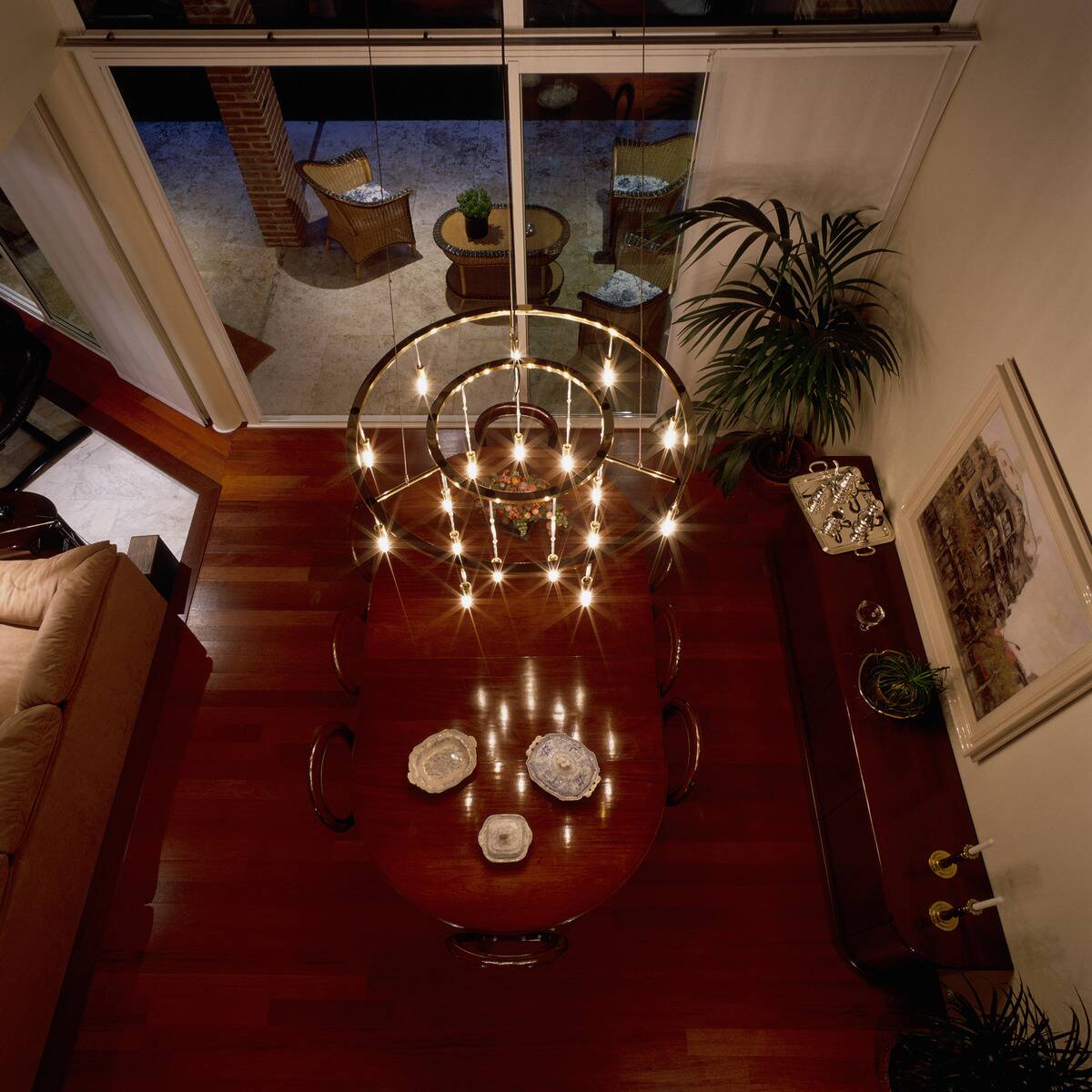 View of an illuminated chandelier above a dining table